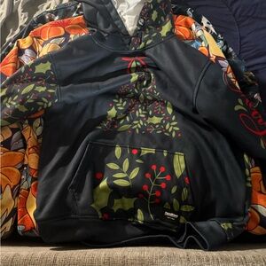 Patterned Black Hoodie with Red and Green Accents